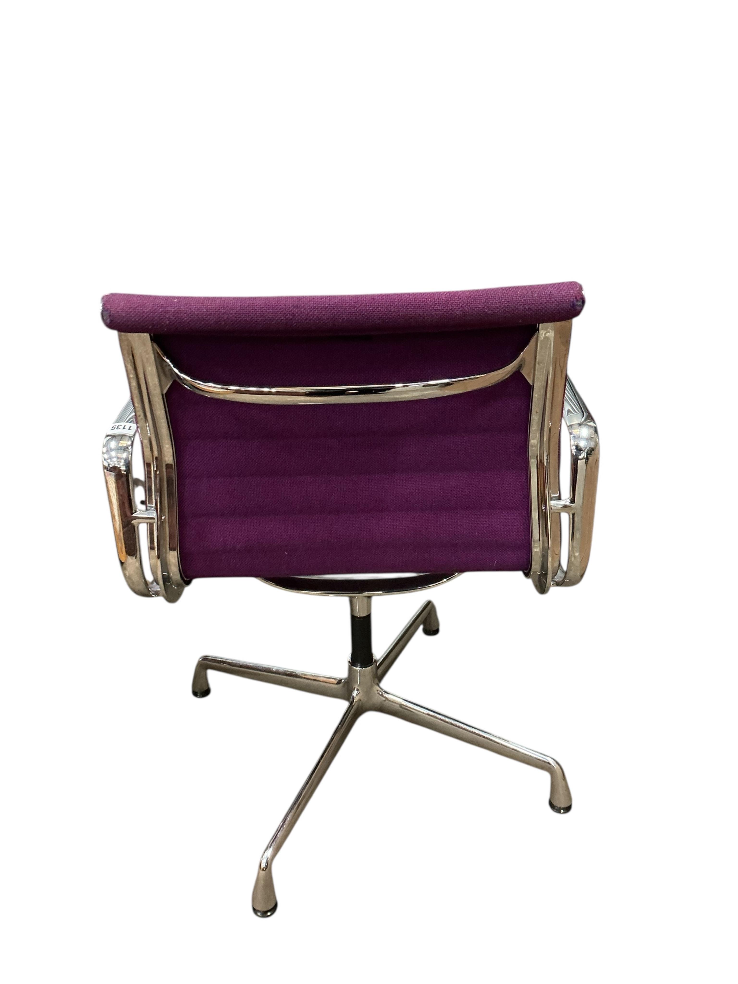 Charles Eames for Vitra, a chrome swivel desk chair on four prong base, width 57cm, depth 50cm, height 82cm